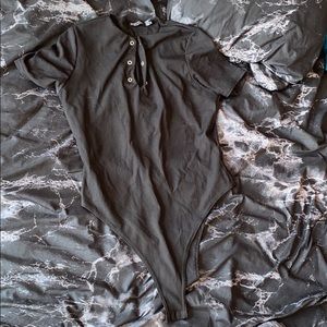 black ribbed bodysuit with silver buttons